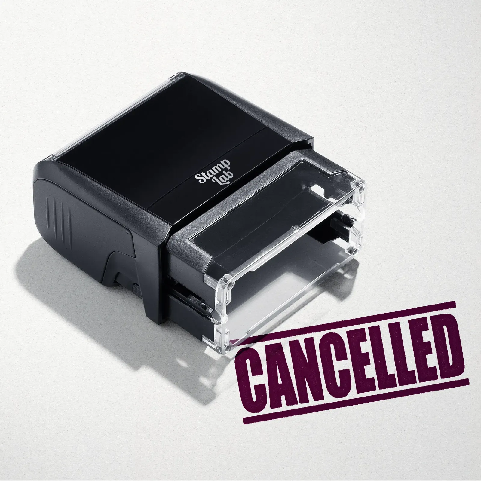 mock up design or lifestyle image of 'Cancelled' rubber stamp maroon ink in paper background stampers hand stamp office business inventory documents self inking prefill refillable stamps stamping 
