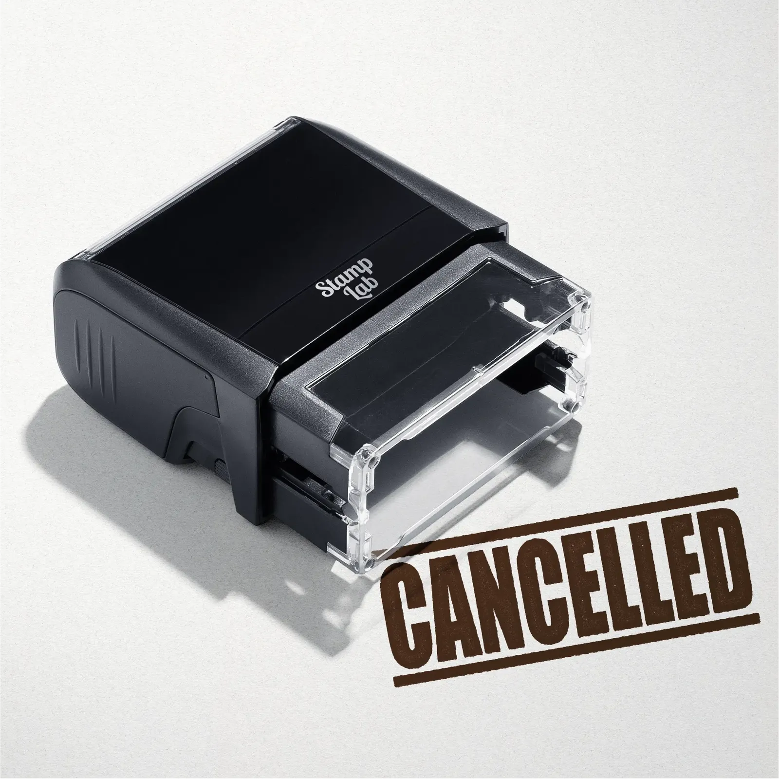 mock up design or lifestyle image of 'Cancelled' rubber stamp brown ink in paper background stampers hand stamp office business inventory documents self inking prefill refillable stamps stamping 
