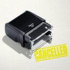 mock up design or lifestyle image of 'Cancelled' rubber stamp yellow ink in paper background stampers hand stamp office business inventory documents self inking prefill refillable stamps stamping 
