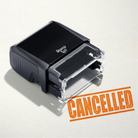 mock up design or lifestyle image of 'Cancelled' rubber stamp orange ink in paper background stampers hand stamp office business inventory documents self inking prefill refillable stamps stamping 
