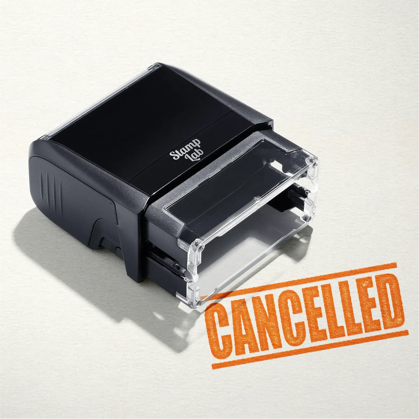 mock up design or lifestyle image of 'Cancelled' rubber stamp orange ink in paper background stampers hand stamp office business inventory documents self inking prefill refillable stamps stamping 
