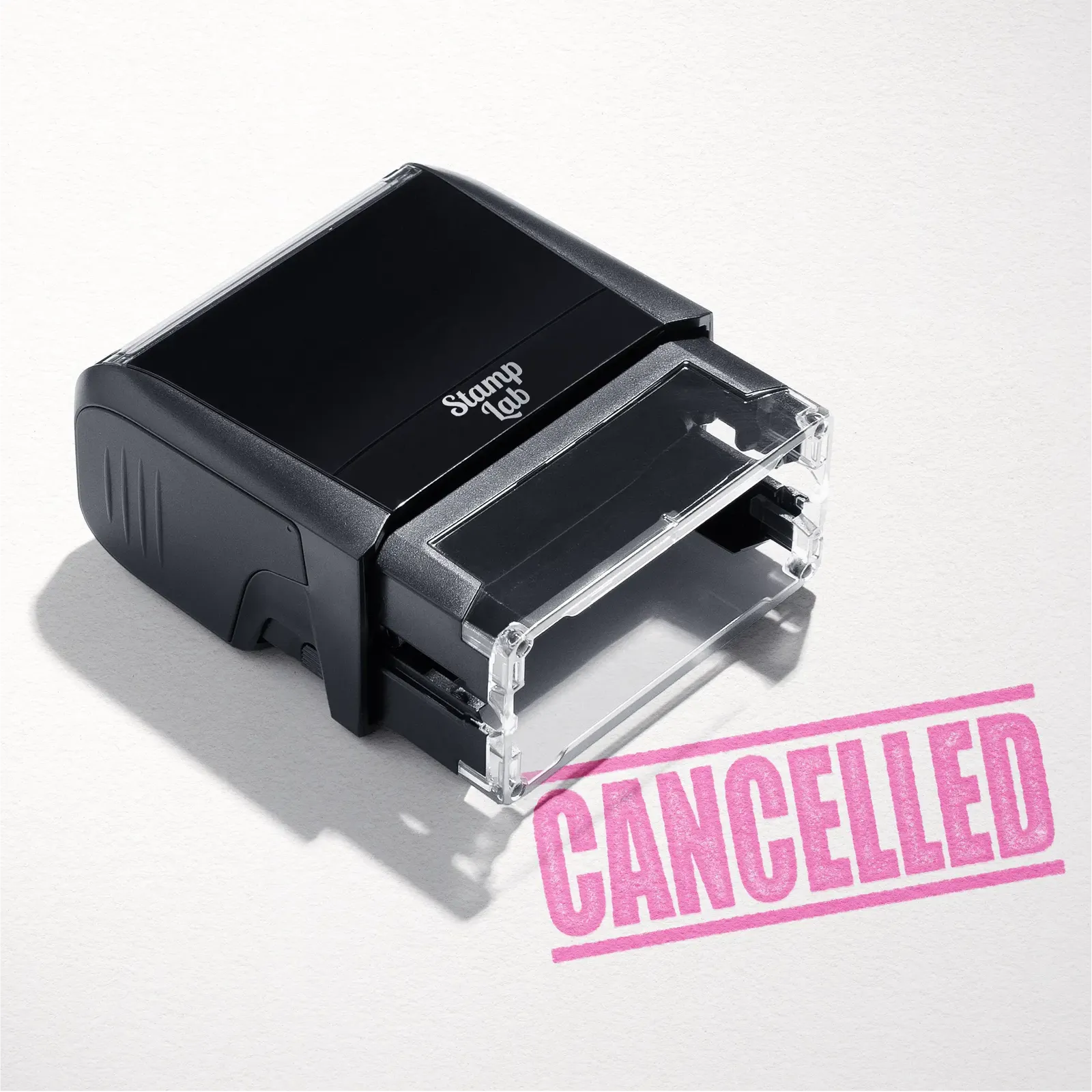 mock up design or lifestyle image of 'Cancelled' rubber stamp pink ink in paper background stampers hand stamp office business inventory documents self inking prefill refillable stamps stamping 
