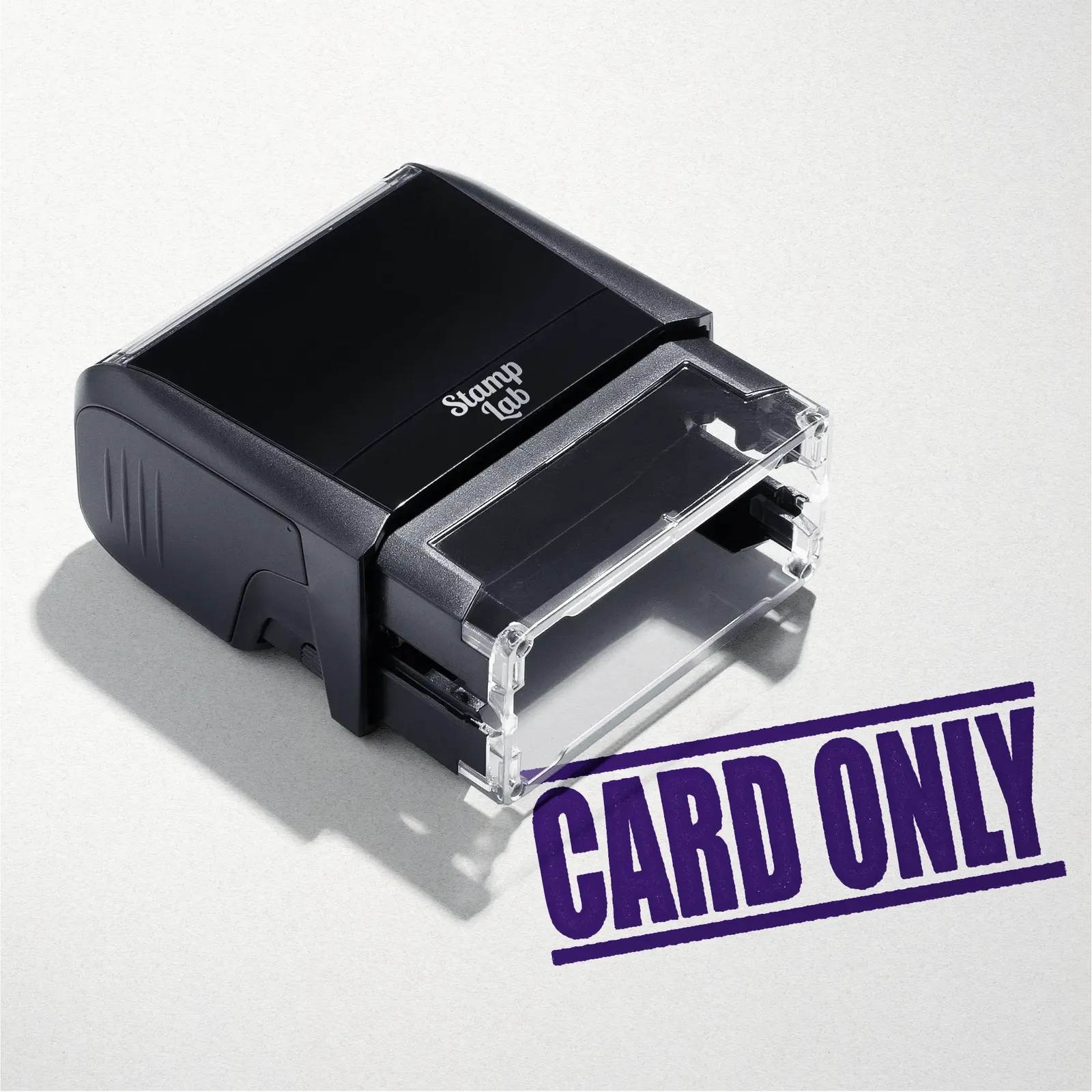 mock up design or lifestyle image of 'Card Only' rubber stamp violet ink in paper background stampers hand stamp office business inventory documents purple
