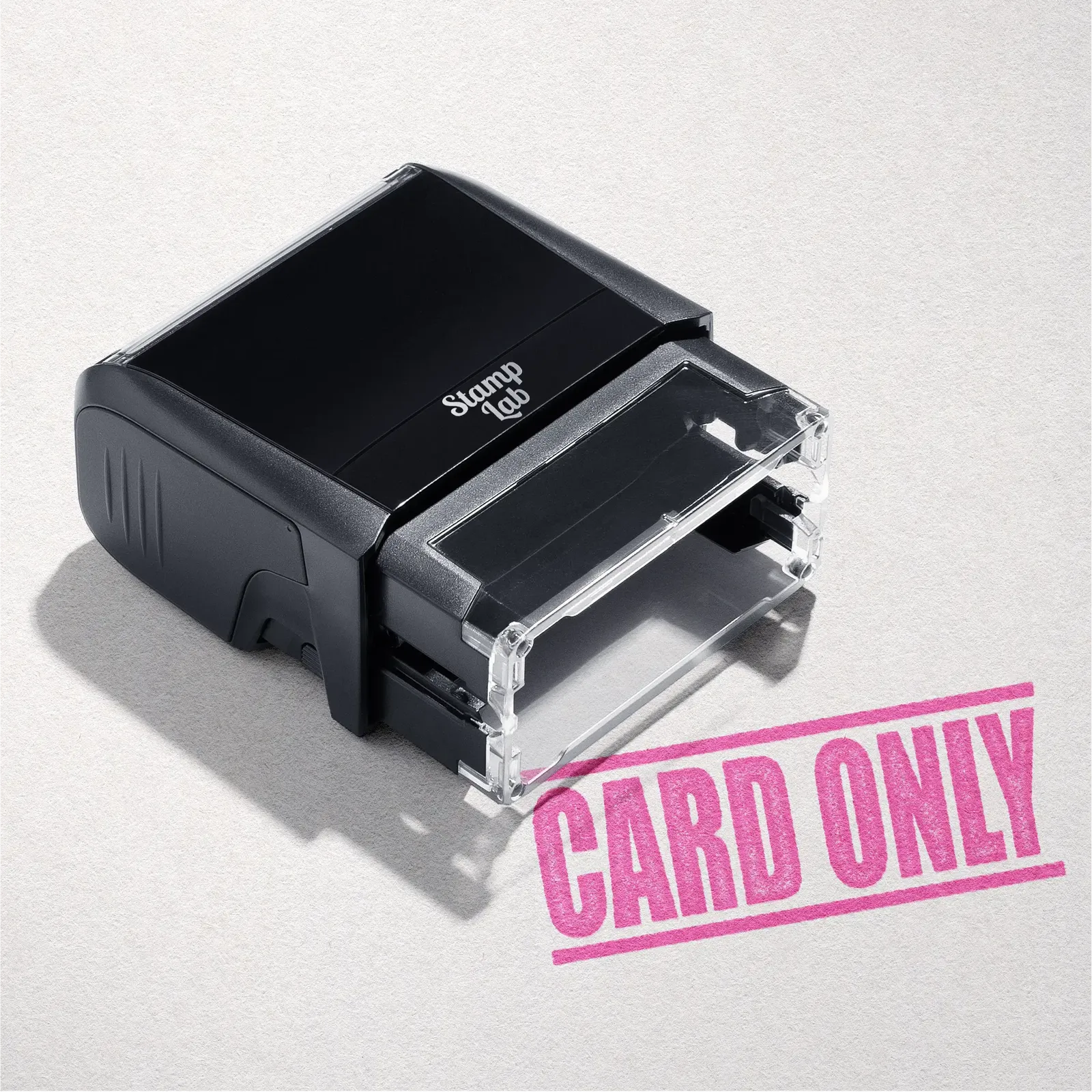 mock up design or lifestyle image of 'Card Only' rubber stamp pink ink in paper background stampers hand stamp office business inventory documents
