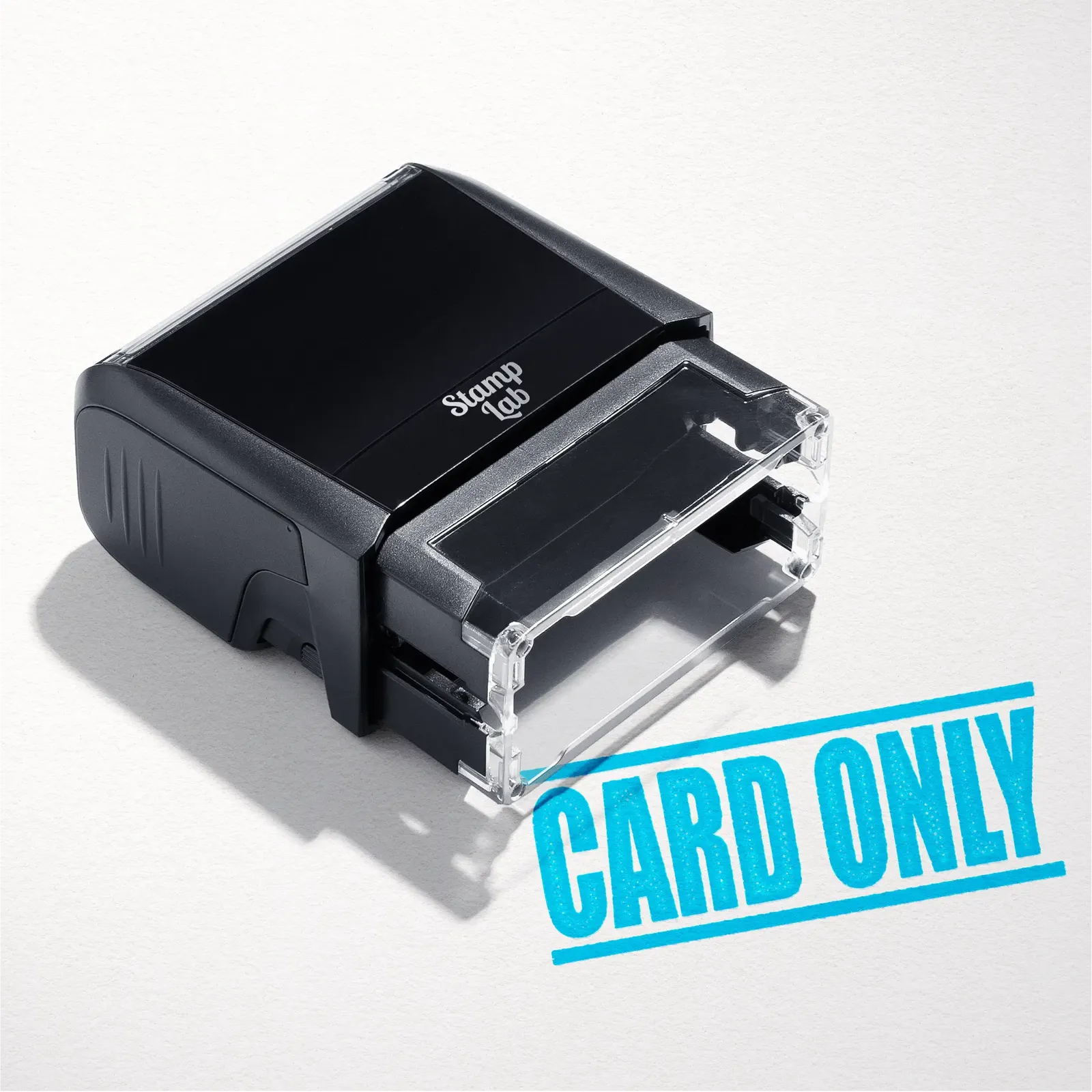 mock up design or lifestyle image of 'Card Only' rubber stamp turquoise ink in paper background stampers hand stamp office business inventory documents
