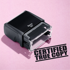 mock up design or lifestyle image of 'Certified True Copy' rubber stamp black ink in paper background stampers hand stamp office business inventory documents self inking prefill refillable stamps stamping 
