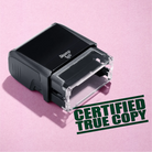 mock up design or lifestyle image of 'Certified True Copy' rubber stamp green ink in paper background stampers hand stamp office business inventory documents self inking prefill refillable stamps stamping 
