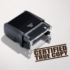 mock up design or lifestyle image of 'Certified True Copy' rubber stamp brown ink in paper background stampers hand stamp office business inventory documents self inking prefill refillable stamps stamping 
