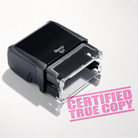 mock up design or lifestyle image of 'Certified True Copy' rubber stamp pink ink in paper background stampers hand stamp office business inventory documents self inking prefill refillable stamps stamping 
