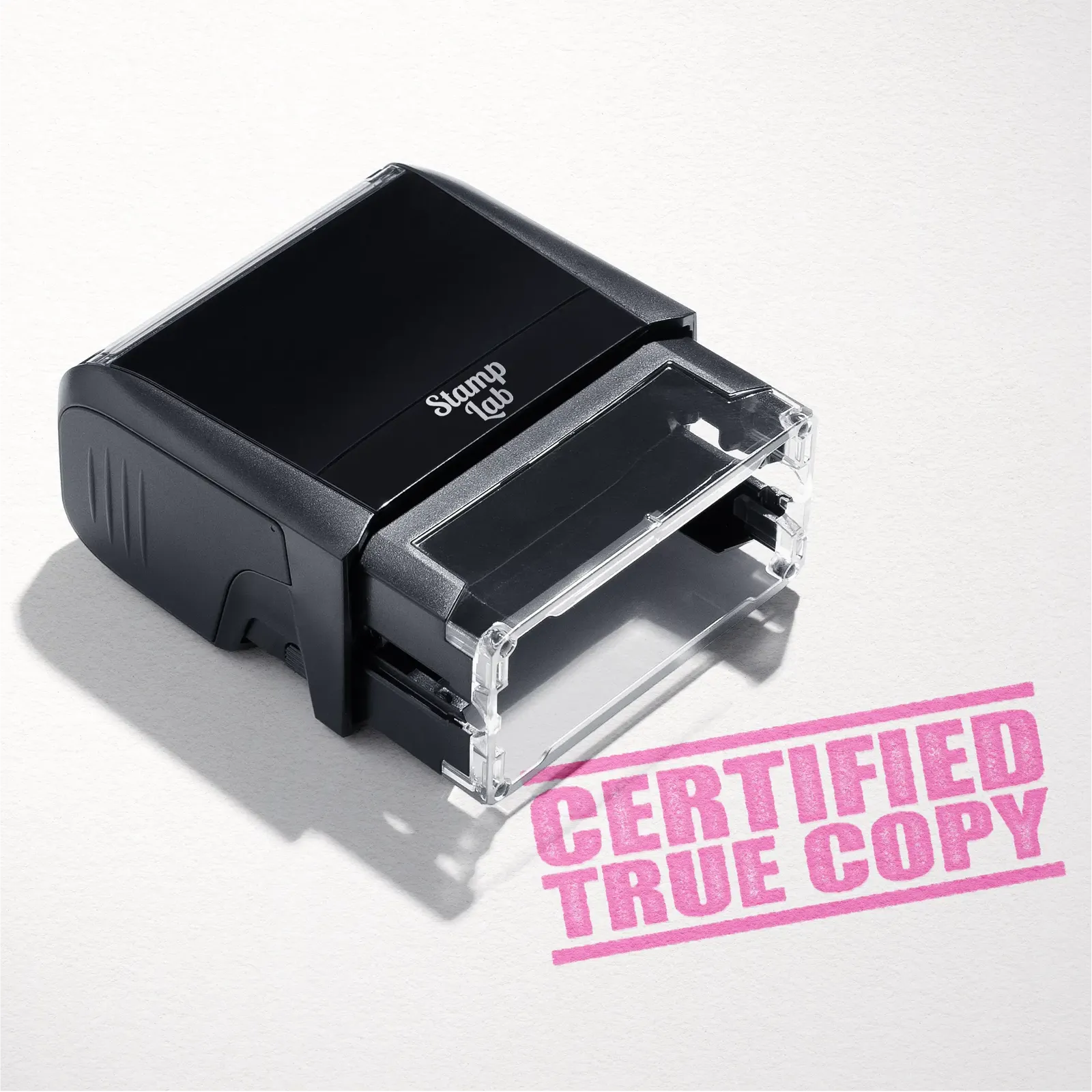 mock up design or lifestyle image of 'Certified True Copy' rubber stamp pink ink in paper background stampers hand stamp office business inventory documents self inking prefill refillable stamps stamping 
