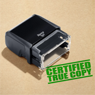 mock up design or lifestyle image of 'Certified True Copy' rubber stamp apple green ink in paper background stampers hand stamp office business inventory documents self inking prefill refillable stamps stamping 
