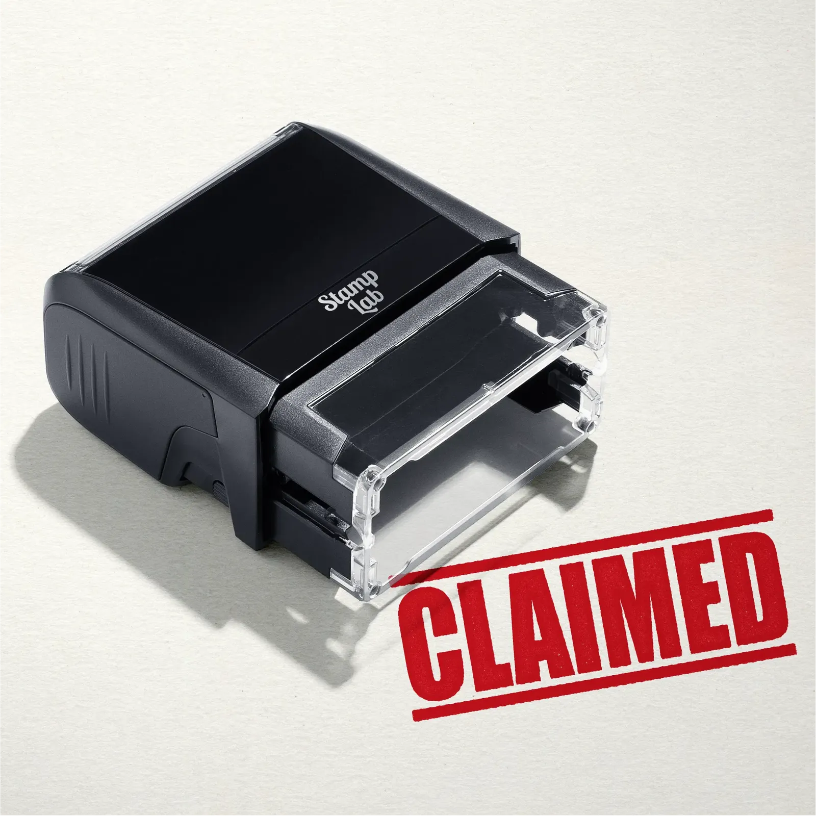 mock up design or lifestyle image of 'Claimed' rubber stamp red ink in paper background stampers hand stamp office business inventory documents self inking prefill refillable stamps stamping 
