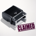 mock up design or lifestyle image of 'Claimed' rubber stamp maroon ink in paper background stampers hand stamp office business inventory documents self inking prefill refillable stamps stamping 
