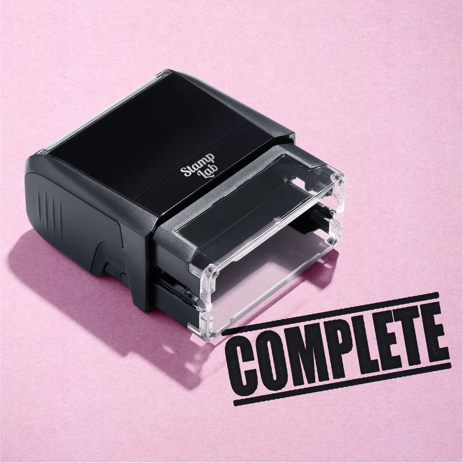 mock up design or lifestyle image of 'Complete' rubber stamp black ink in paper background stampers hand stamp office business inventory documents
