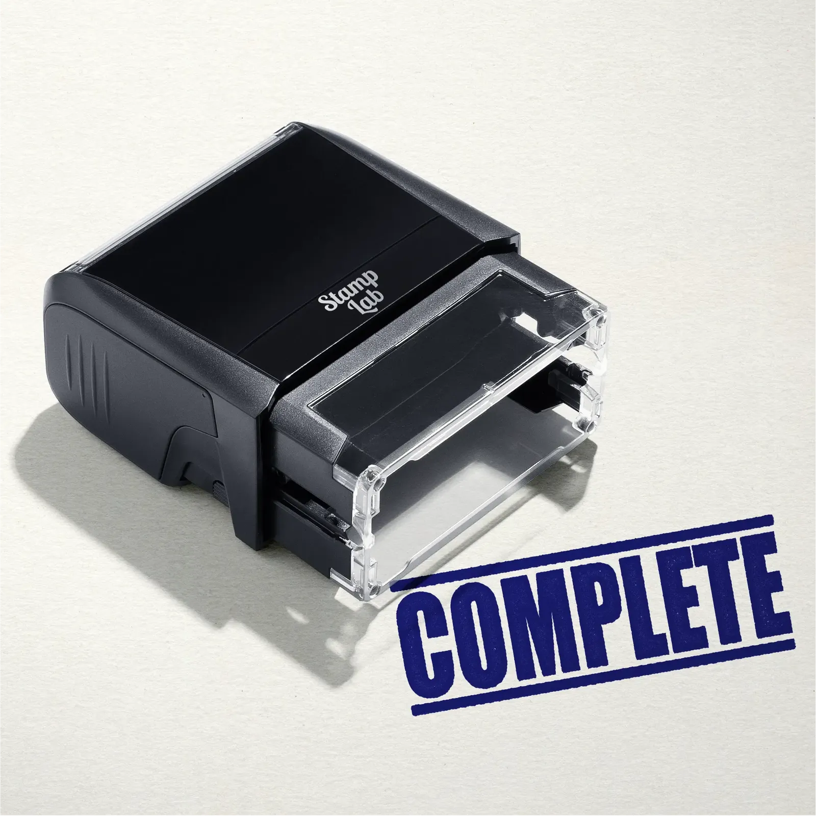 mock up design or lifestyle image of 'Complete' rubber stamp blue ink in paper background stampers hand stamp office business inventory documents
