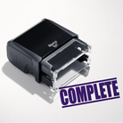 mock up design or lifestyle image of 'Complete' rubber stamp violet ink in paper background stampers hand stamp office business inventory documents purple
