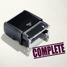 mock up design or lifestyle image of 'Complete' rubber stamp maroon ink in paper background stampers hand stamp office business inventory documents
