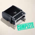 mock up design or lifestyle image of 'Complete' rubber stamp mint ink in paper background stampers hand stamp office business inventory documents
