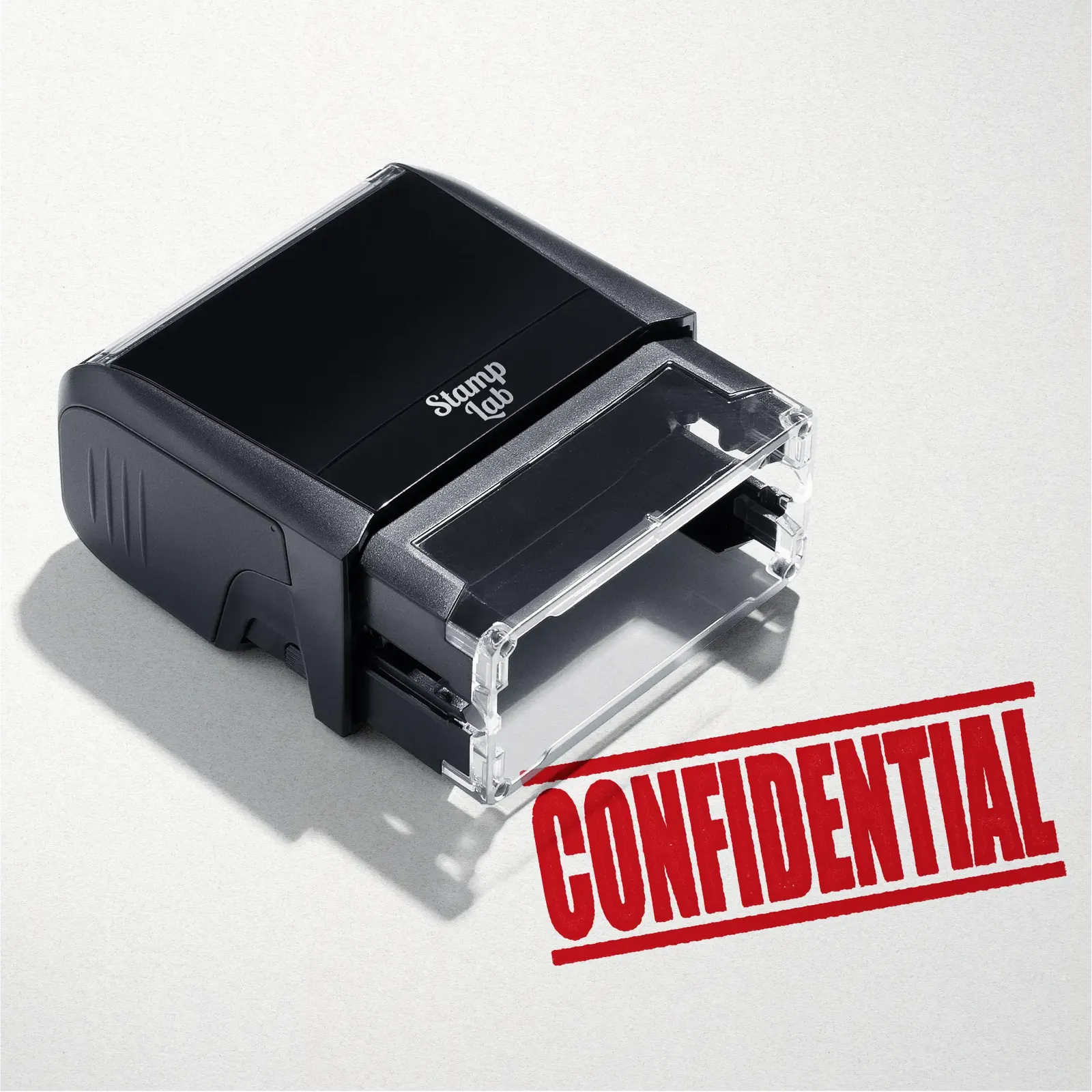 mock up design or lifestyle image of 'Confidential' rubber stamp red ink in paper background stampers hand stamp office business inventory documents self inking prefill refillable stamps stamping 
