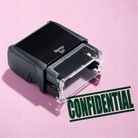 mock up design or lifestyle image of 'Confidential' rubber stamp green ink in paper background stampers hand stamp office business inventory documents self inking prefill refillable stamps stamping 
