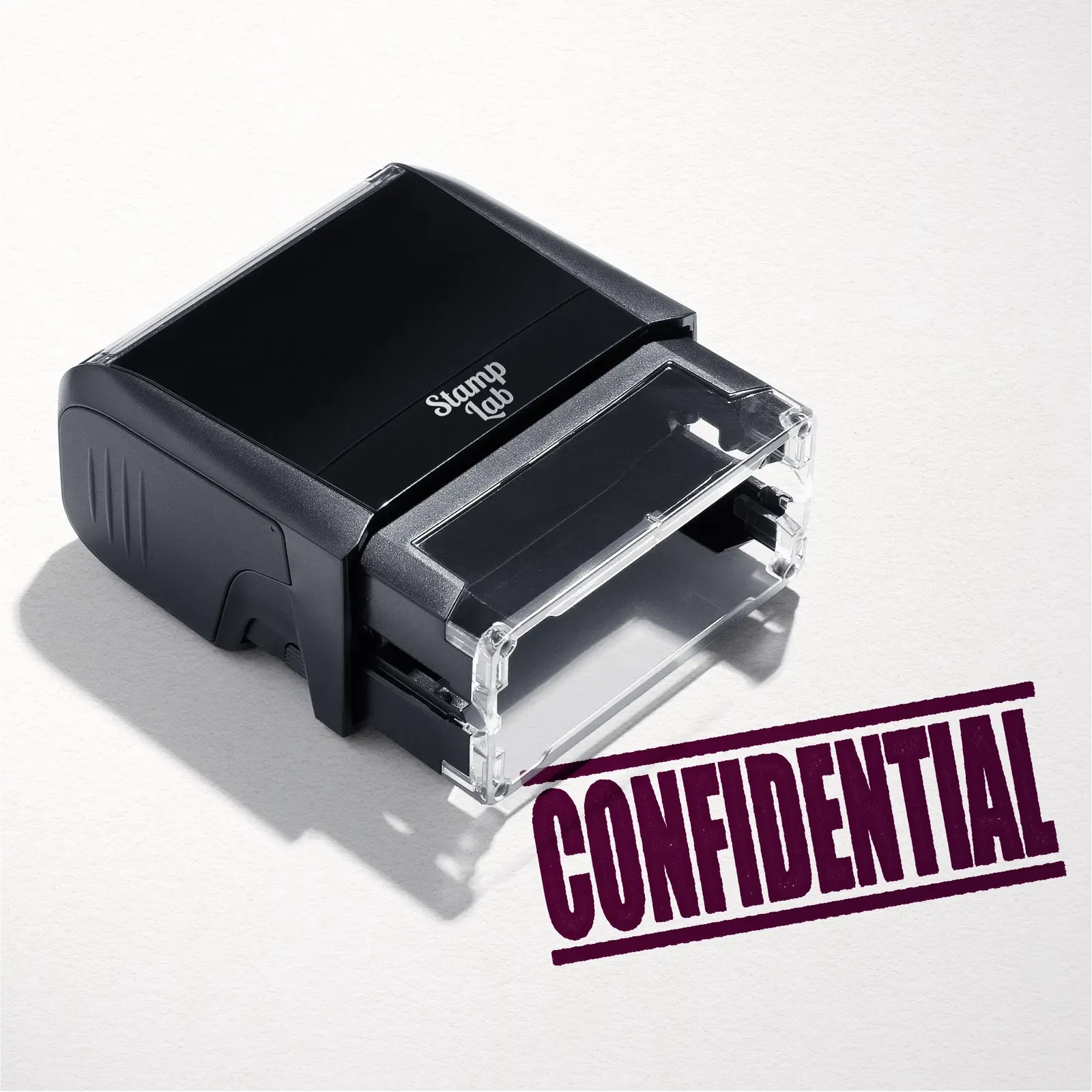 mock up design or lifestyle image of 'Confidential' rubber stamp maroon ink in paper background stampers hand stamp office business inventory documents self inking prefill refillable stamps stamping 
