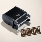 mock up design or lifestyle image of 'Confidential' rubber stamp brown ink in paper background stampers hand stamp office business inventory documents self inking prefill refillable stamps stamping 
