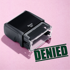 mock up design or lifestyle image of 'Denied' rubber stamp green ink in paper background stampers hand stamp office business inventory documents self inking prefill refillable stamps stamping 
