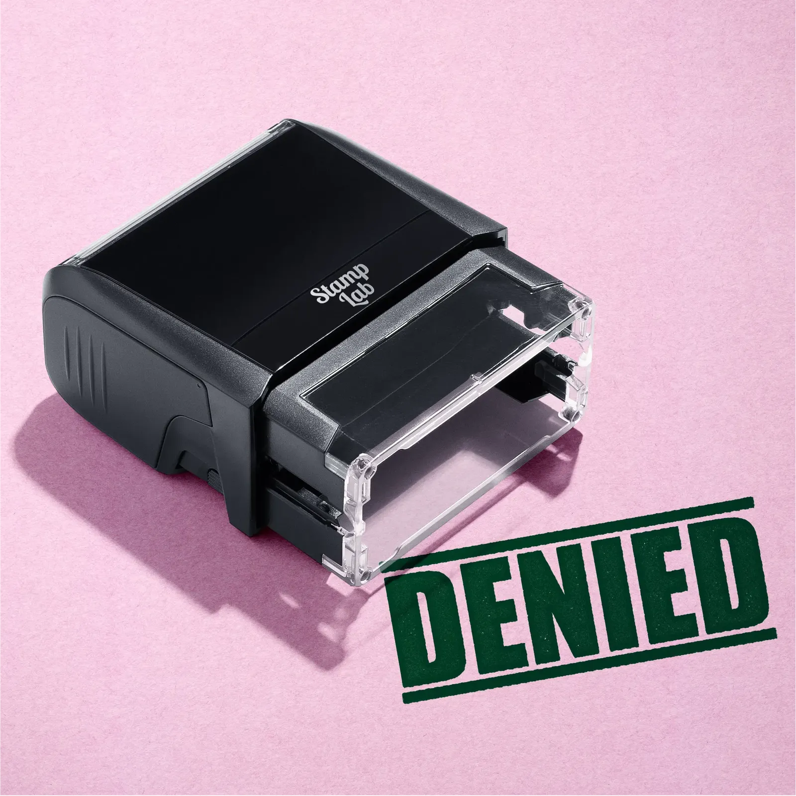 mock up design or lifestyle image of 'Denied' rubber stamp green ink in paper background stampers hand stamp office business inventory documents self inking prefill refillable stamps stamping 
