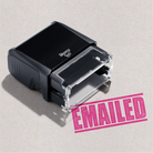 Mock up design or lifestyle image of 'EMAILED' rubber stamp pink ink in paper background stampers hand stamp office business inventory documents 

