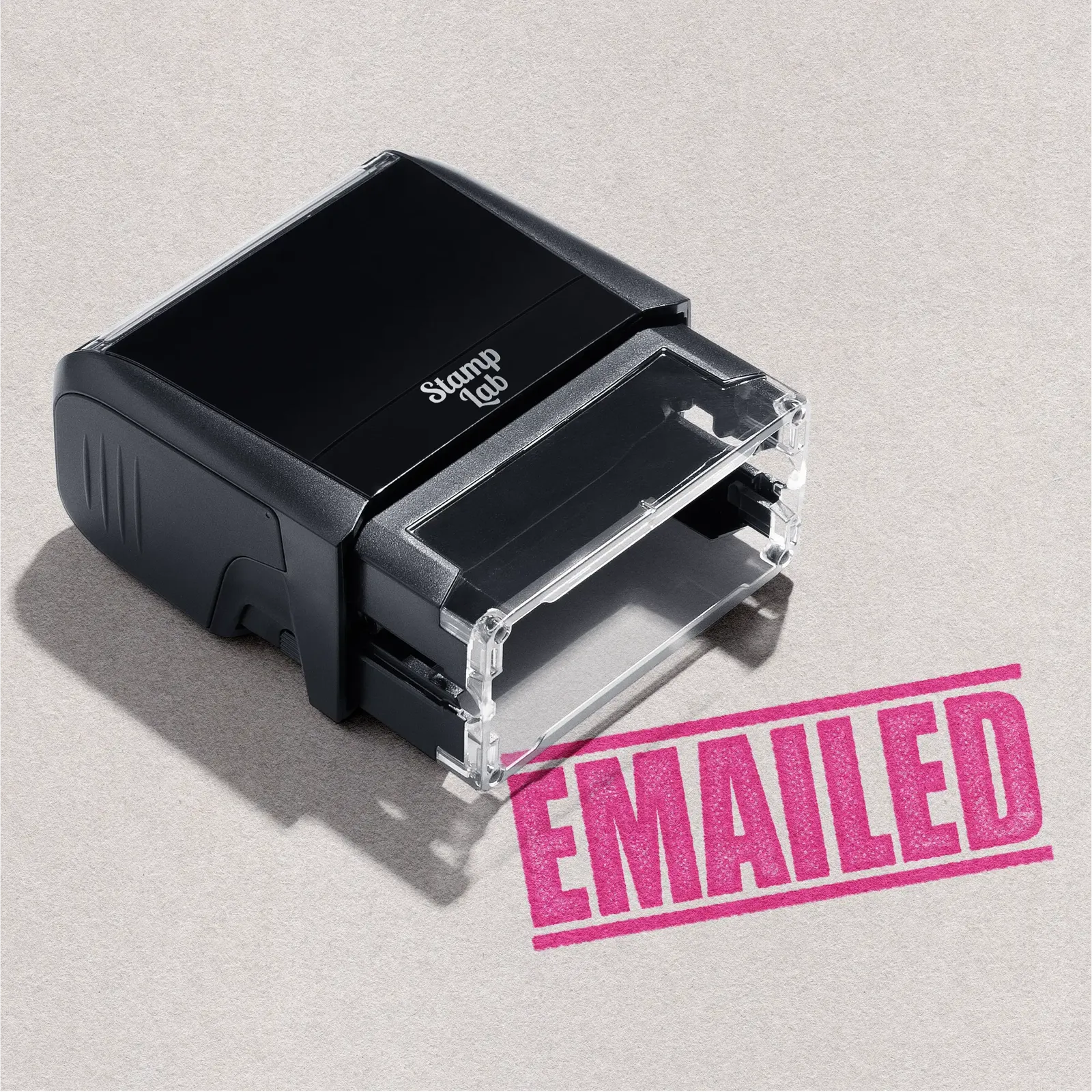 Mock up design or lifestyle image of 'EMAILED' rubber stamp pink ink in paper background stampers hand stamp office business inventory documents 

