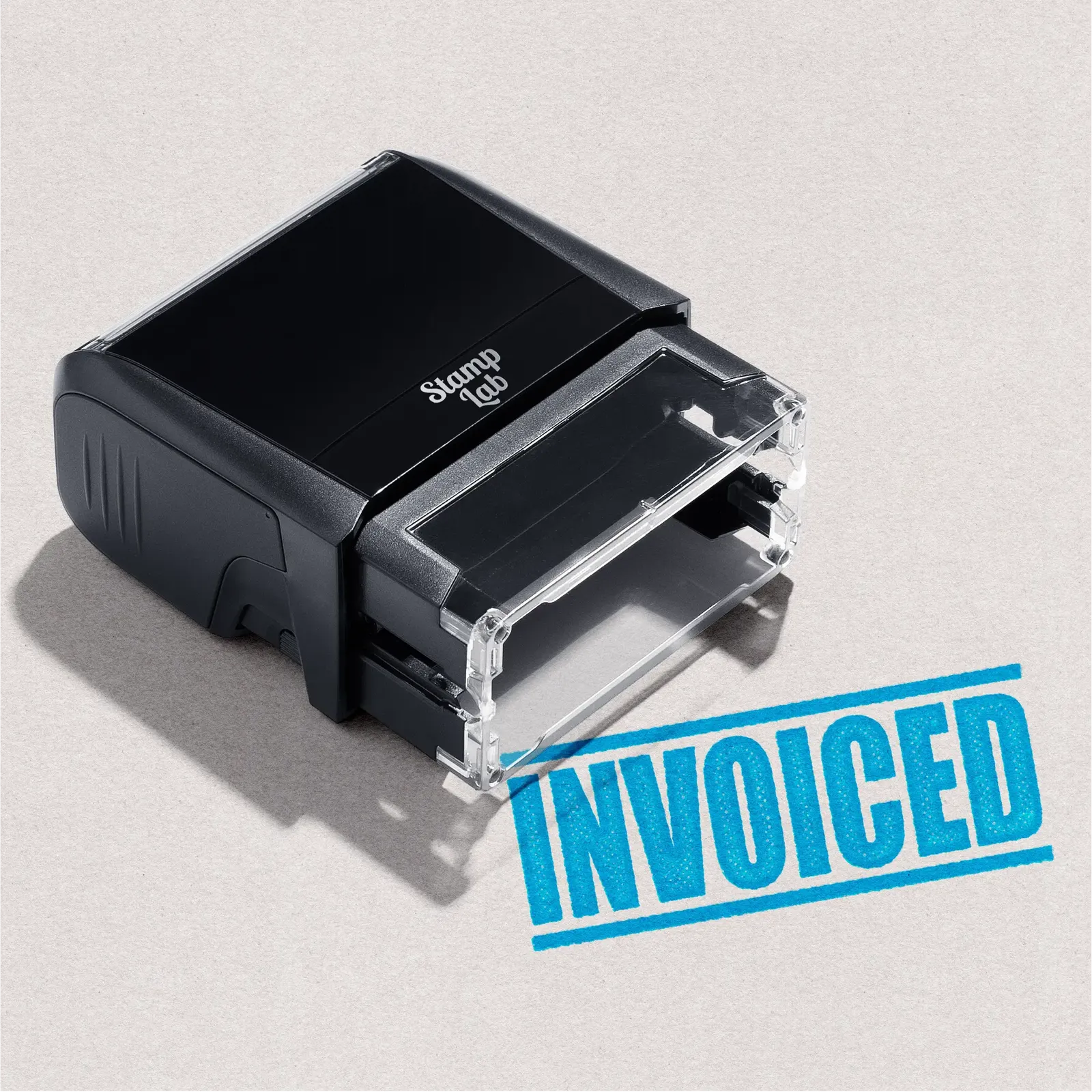 mock up design or lifestyle image of INVOICED rubber stamp turquoise ink in paper background stampers hand stamp office business inventory documents
