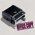mock up design or lifestyle image of 'Office Copy' rubber stamp maroon ink in paper background stampers hand stamp office business inventory documents self inking prefill refillable stamps stamping 
