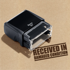 Readymade RECEIVED IN DAMAGED CONDITION hand stamp Brown ink 