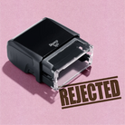 Pre-inked rubber stamp, ready made design REJECTED in Brown ink
