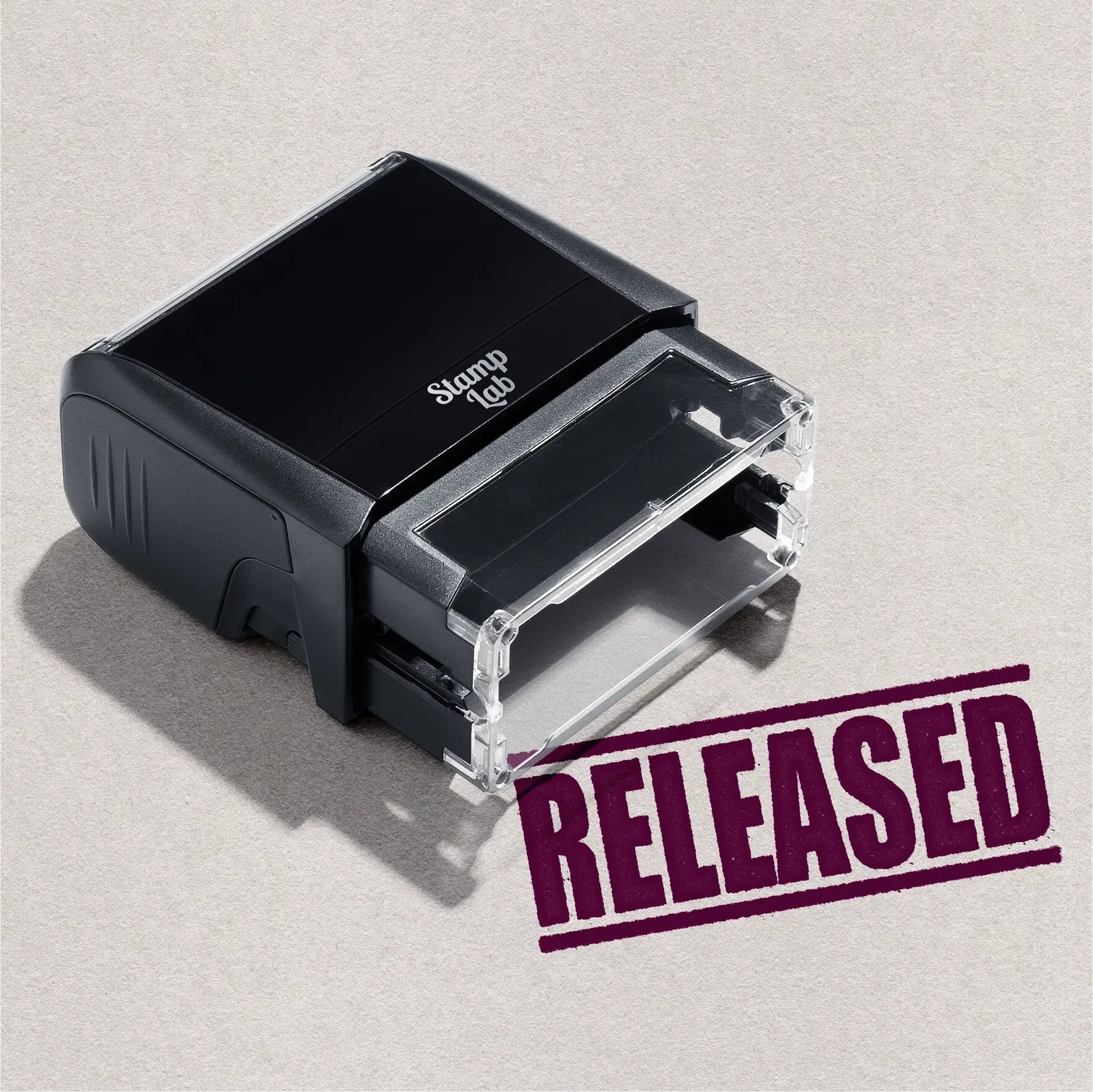 self-inking hand stamper "RELEASED" design in Maroon ink