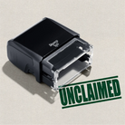 green self-inking rubber stamp unclaimed text 