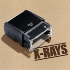 Black stamp with 'X-RAYS' text on a brown background