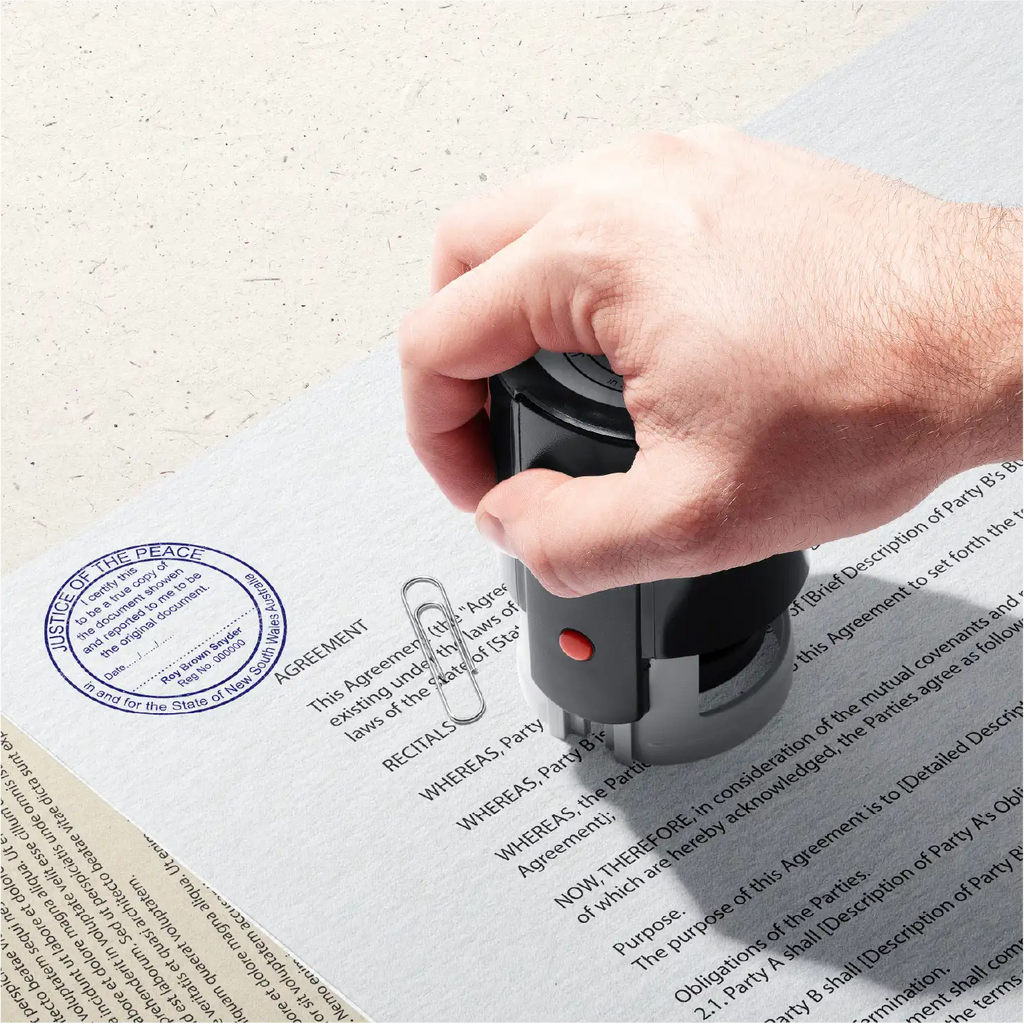 Mockup of Hand stamping Blue Large Round True Copy Stamp on a document